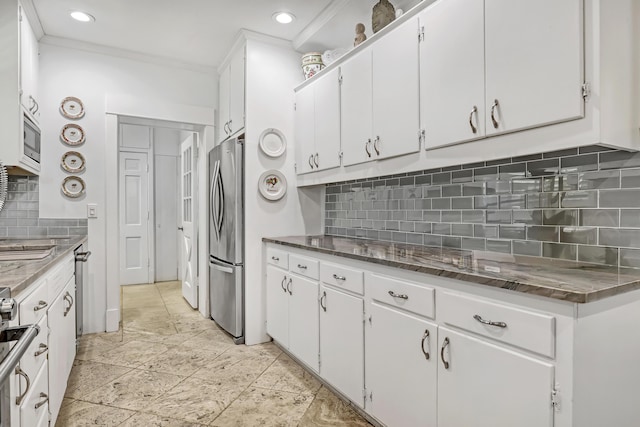 134 Worth Ct N, West Palm Beach, FL 33405 - kitchen featuring appliances with stainless steel finishes, decorative backsplash, white cabinetry, recessed lighting, and dark stone counters