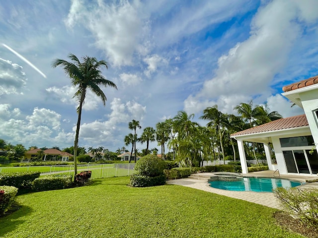 1186 Breakers W Blvd, West Palm Beach, FL 33411 - view of swimming pool with a pool with connected hot tub and a patio