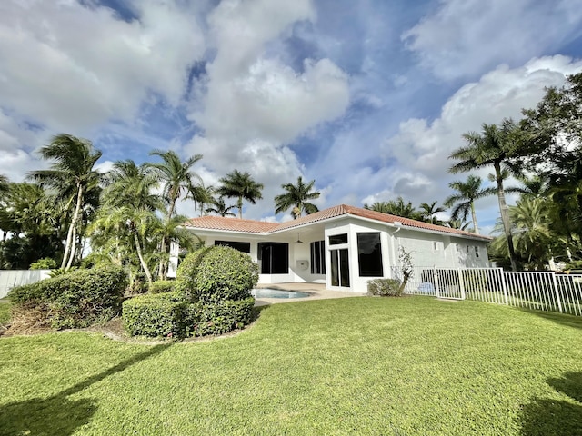 1186 Breakers W Blvd, West Palm Beach, FL 33411 - back of house featuring a tiled roof and stucco siding