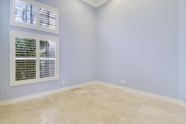 1186 Breakers W Blvd, West Palm Beach, FL 33411 - empty room with baseboards and crown molding