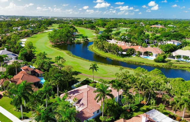 1186 Breakers W Blvd, West Palm Beach, FL 33411 - aerial perspective of suburban area with a golf course, a large body of water, and a tree filled landscape