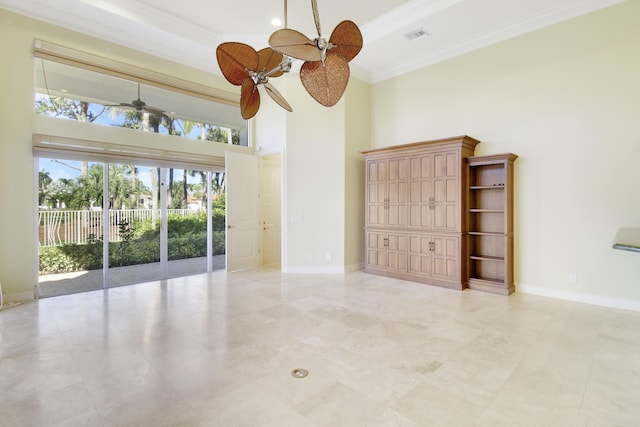 1186 Breakers W Blvd, West Palm Beach, FL 33411 - empty room with a high ceiling, a ceiling fan, crown molding, and baseboards