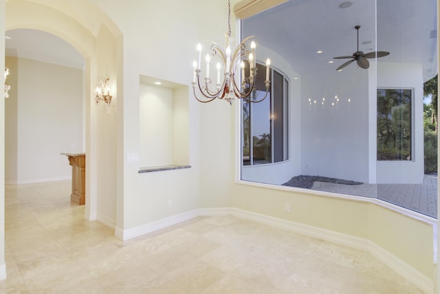 1186 Breakers W Blvd, West Palm Beach, FL 33411 - empty room featuring ceiling fan, arched walkways, a chandelier, and recessed lighting