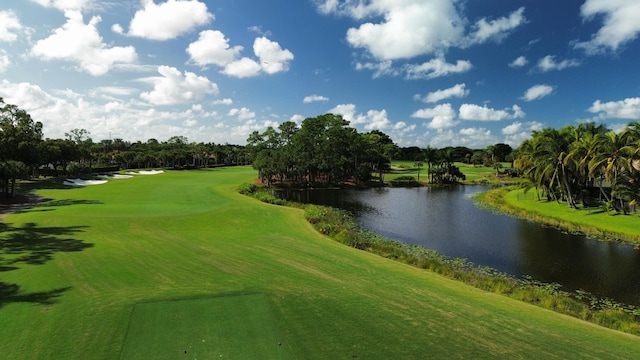 1186 Breakers W Blvd, West Palm Beach, FL 33411 - surrounding community with a water view, golf course view, and view of wooded area