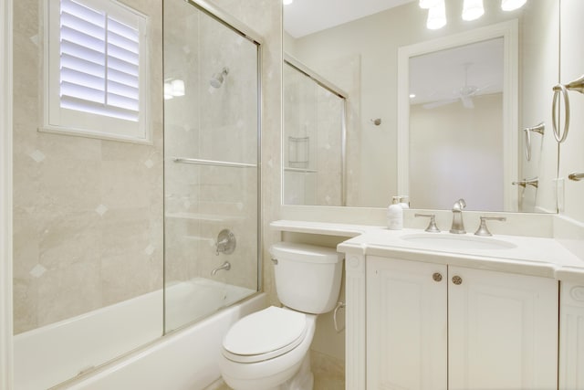 1186 Breakers W Blvd, West Palm Beach, FL 33411 - full bath featuring toilet, vanity, shower / bath combination with glass door, and a ceiling fan