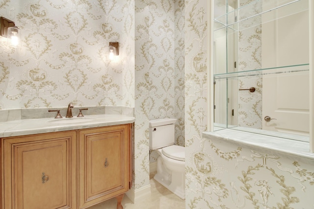 1186 Breakers W Blvd, West Palm Beach, FL 33411 - half bathroom with toilet, vanity, and wallpapered walls