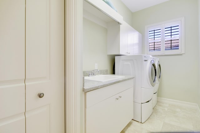 1186 Breakers W Blvd, West Palm Beach, FL 33411 - washroom featuring a sink, washing machine and clothes dryer, and baseboards