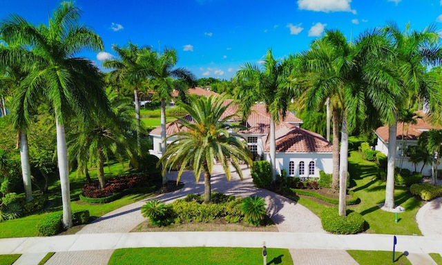 1186 Breakers W Blvd, West Palm Beach, FL 33411 - mediterranean / spanish-style house with decorative driveway