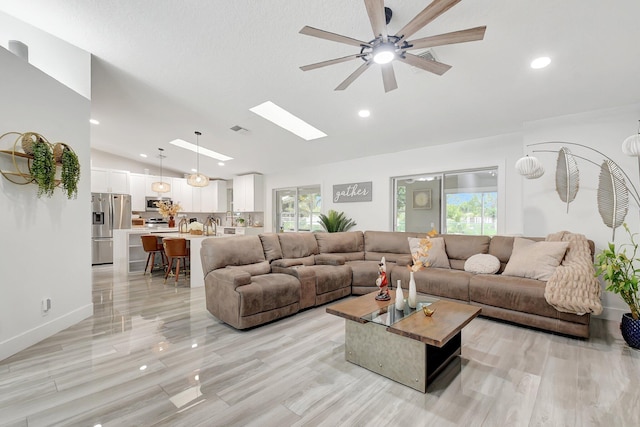298 Las Palmas St, Royal Palm Beach, FL 33411 - living room with lofted ceiling, ceiling fan, plenty of natural light, a skylight, and recessed lighting