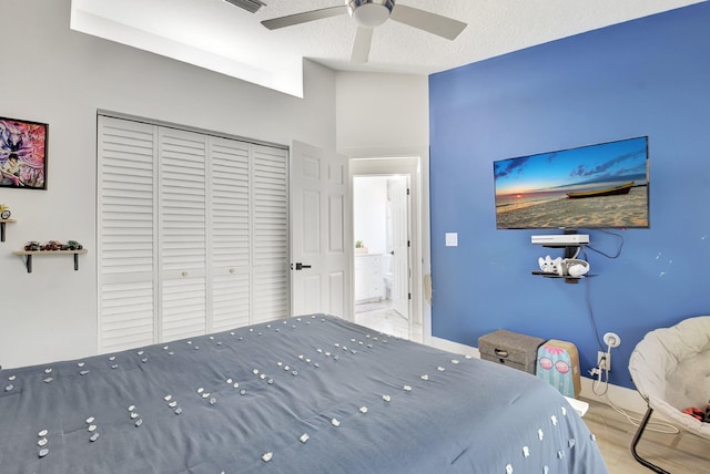 298 Las Palmas St, Royal Palm Beach, FL 33411 - bedroom featuring a closet, vaulted ceiling, wood finished floors, baseboards, and a ceiling fan