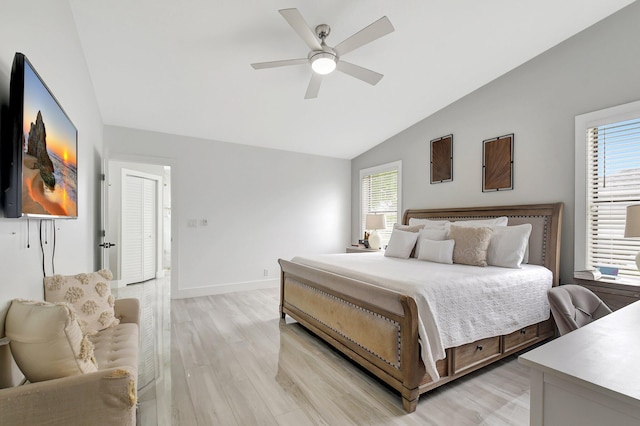 298 Las Palmas St, Royal Palm Beach, FL 33411 - bedroom featuring vaulted ceiling, light wood-style floors, multiple windows, baseboards, and ceiling fan