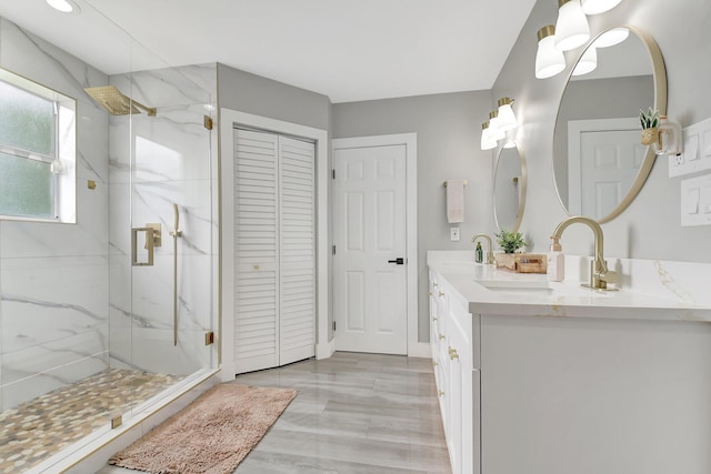 298 Las Palmas St, Royal Palm Beach, FL 33411 - bathroom featuring a marble finish shower, a closet, and double vanity