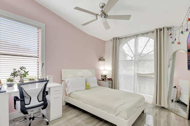 298 Las Palmas St, Royal Palm Beach, FL 33411 - bedroom featuring light wood finished floors, a desk, multiple windows, lofted ceiling, and ceiling fan