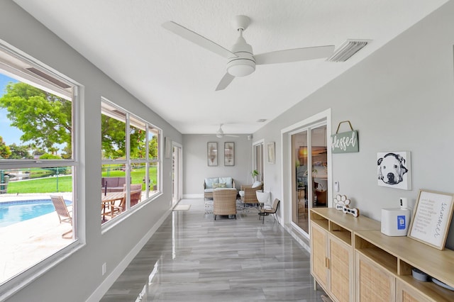 298 Las Palmas St, Royal Palm Beach, FL 33411 - sunroom / solarium featuring a ceiling fan and baseboards