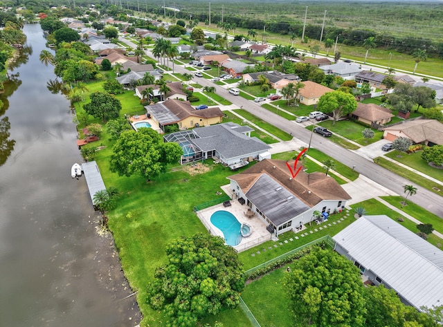 298 Las Palmas St, Royal Palm Beach, FL 33411 - aerial perspective of suburban area featuring a large body of water and a pool area
