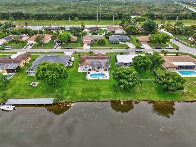 298 Las Palmas St, Royal Palm Beach, FL 33411 - aerial perspective of suburban area featuring a pool and a nearby body of water