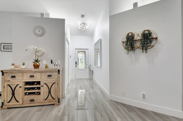 298 Las Palmas St, Royal Palm Beach, FL 33411 - hall featuring baseboards and light wood finished floors