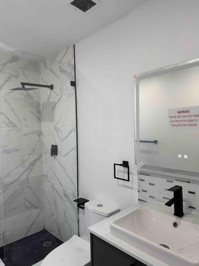 3056 NE 14th Ave, Oakland Park, FL 33334 - full bath with toilet, vanity, a marble finish shower, and backsplash