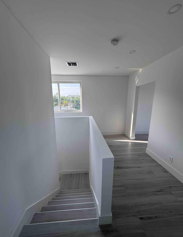 3056 NE 14th Ave, Oakland Park, FL 33334 - stairs with baseboards and wood finished floors