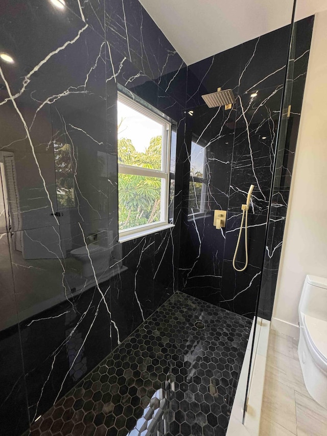 3056 NE 14th Ave, Oakland Park, FL 33334 - bathroom with toilet and a marble finish shower