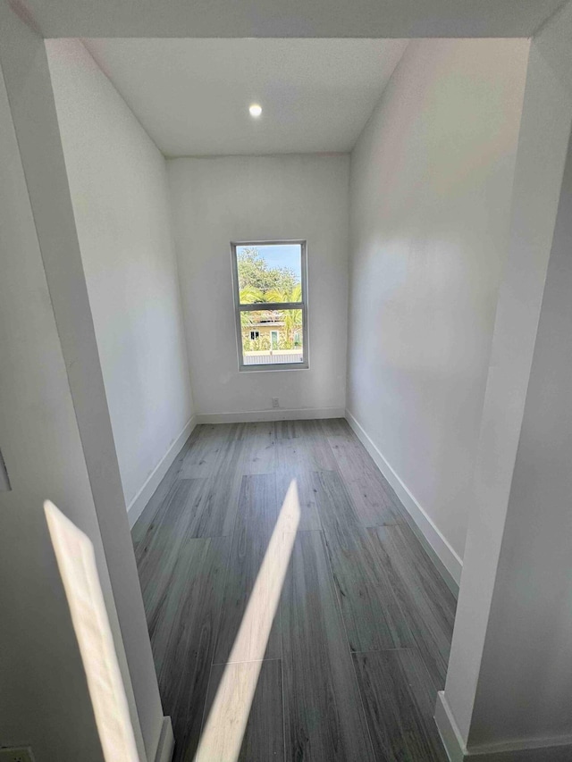 3056 NE 14th Ave, Oakland Park, FL 33334 - spare room with wood finished floors, baseboards, and recessed lighting
