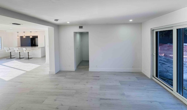 3056 NE 14th Ave, Oakland Park, FL 33334 - empty room featuring recessed lighting, light wood-style floors, and baseboards