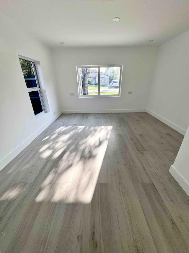 3056 NE 14th Ave, Oakland Park, FL 33334 - unfurnished room with wood finished floors and baseboards