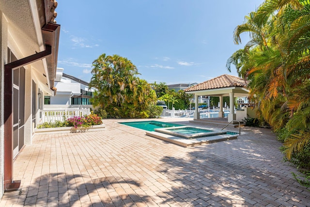 4700 Sanctuary Ln, Boca Raton, FL 33431 - view of swimming pool featuring a gazebo, a patio area, and a pool with connected hot tub