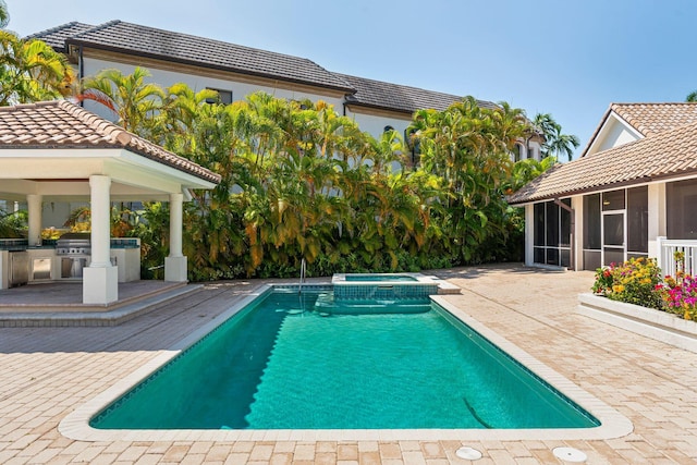4700 Sanctuary Ln, Boca Raton, FL 33431 - view of pool featuring a sunroom, area for grilling, a gazebo, a pool with connected hot tub, and a patio area
