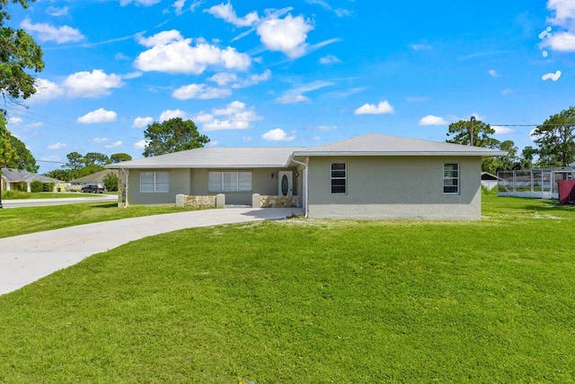 798 SE Atlantus Ave, Port Saint Lucie, FL 34983 - ranch-style house featuring stucco siding, concrete driveway, and a front lawn