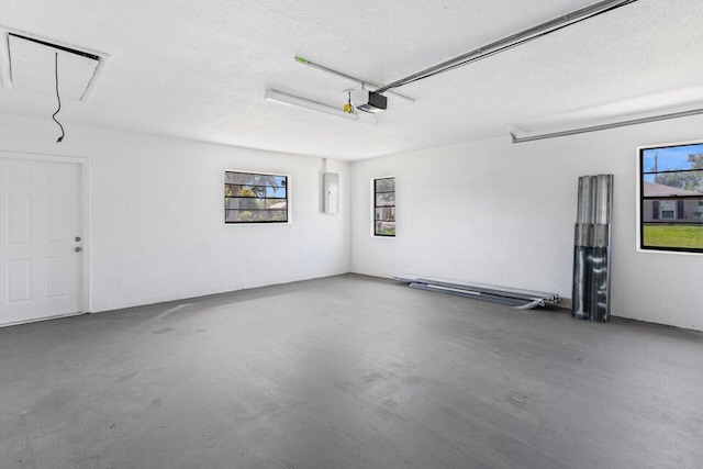 798 SE Atlantus Ave, Port Saint Lucie, FL 34983 - garage with electric panel and a garage door opener