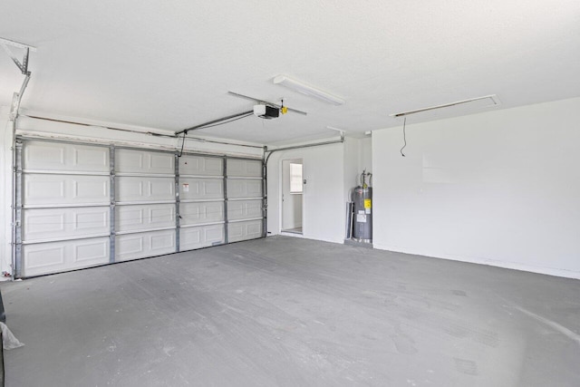 798 SE Atlantus Ave, Port Saint Lucie, FL 34983 - garage with water heater and a garage door opener