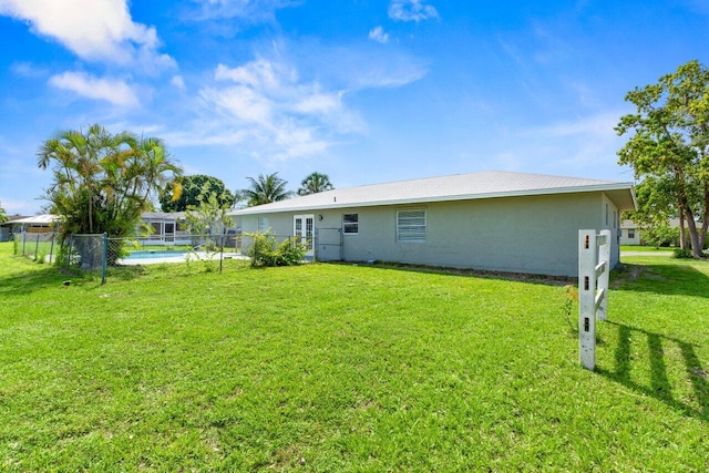 798 SE Atlantus Ave, Port Saint Lucie, FL 34983 - rear view of property featuring stucco siding