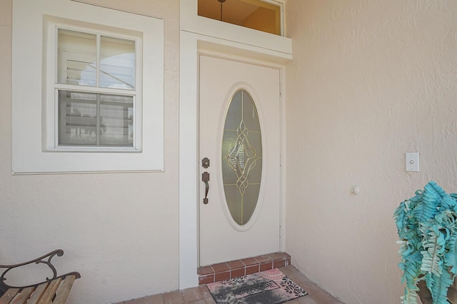 7158 Foxworth Ct, Boynton Beach, FL 33437 - doorway to property with stucco siding