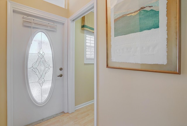 7158 Foxworth Ct, Boynton Beach, FL 33437 - foyer entrance with plenty of natural light, wood finished floors, and baseboards