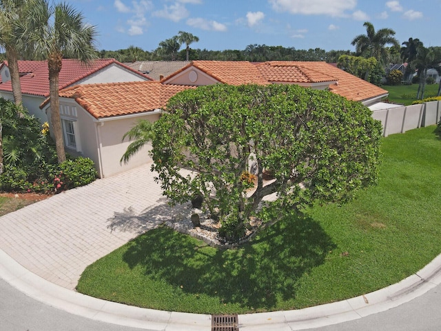7158 Foxworth Ct, Boynton Beach, FL 33437 - mediterranean / spanish-style home featuring a front lawn, a tile roof, decorative driveway, and stucco siding
