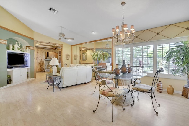 7158 Foxworth Ct, Boynton Beach, FL 33437 - dining area featuring lofted ceiling, wood finished floors, a chandelier, and a ceiling fan