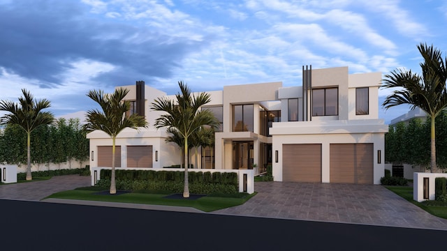 481 Thatch Palm Dr, Boca Raton, FL 33432 - modern home with stucco siding, a garage, decorative driveway, and a balcony