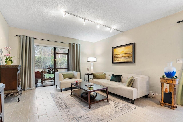 5200 E Club Cir Unit 106, Boca Raton, FL 33487 - living area with light wood-style flooring, a textured ceiling, and rail lighting