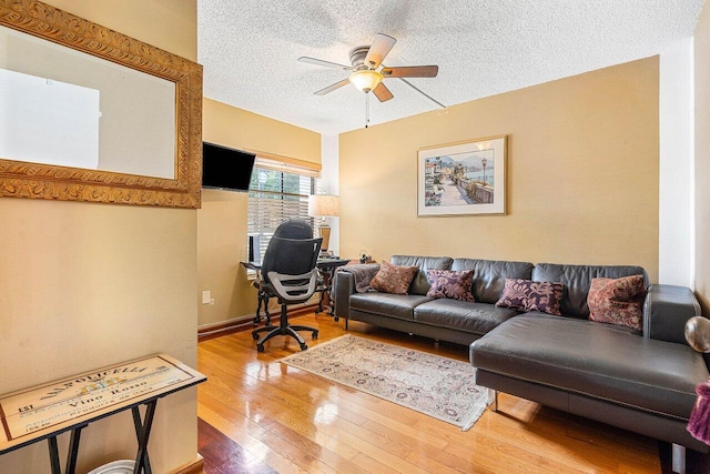 5200 E Club Cir Unit 106, Boca Raton, FL 33487 - living area featuring a ceiling fan, a textured ceiling, an office area, and wood-type flooring