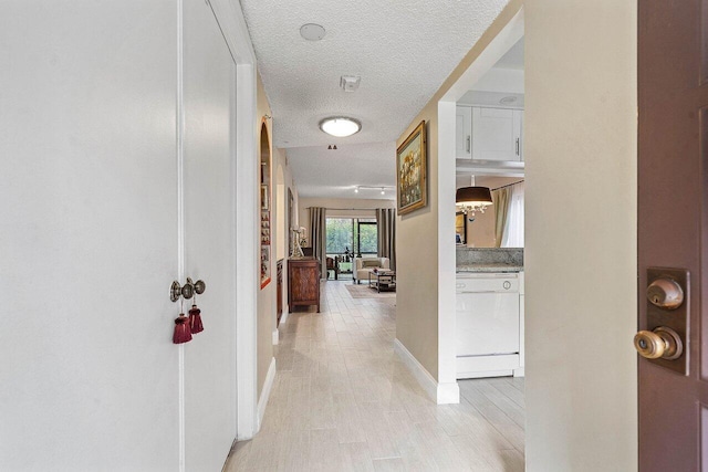 5200 E Club Cir Unit 106, Boca Raton, FL 33487 - corridor with a textured ceiling and baseboards