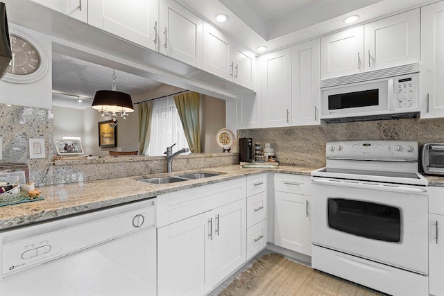 5200 E Club Cir Unit 106, Boca Raton, FL 33487 - kitchen featuring white appliances, a sink, white cabinets, and light stone counters