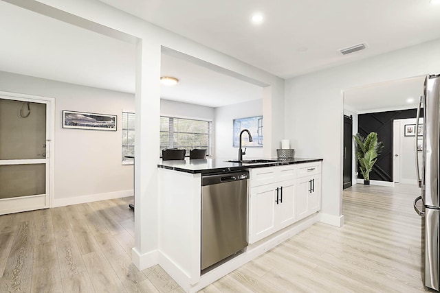 2388 SW Congress Blvd, Boynton Beach, FL 33426 - kitchen featuring stainless steel appliances, a sink, light wood-type flooring, white cabinetry, and recessed lighting