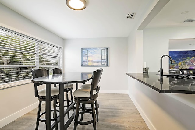 2388 SW Congress Blvd, Boynton Beach, FL 33426 - dining area featuring baseboards and wood finished floors
