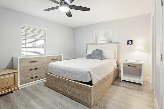 2388 SW Congress Blvd, Boynton Beach, FL 33426 - bedroom featuring light wood finished floors and a ceiling fan
