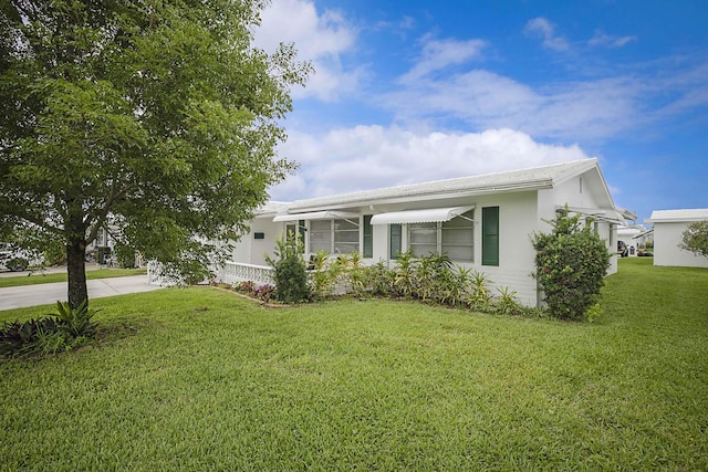 2388 SW Congress Blvd, Boynton Beach, FL 33426 - manufactured / mobile home featuring concrete driveway, a front yard, and stucco siding