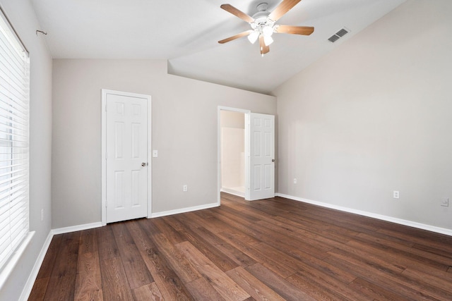 1552 SW Neponset Rd, Port Saint Lucie, FL 34953 - unfurnished bedroom featuring lofted ceiling, dark wood-type flooring, baseboards, and a ceiling fan