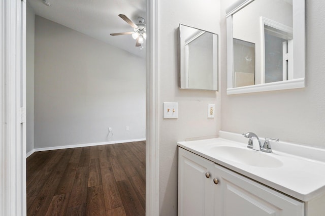 1552 SW Neponset Rd, Port Saint Lucie, FL 34953 - bathroom with wood finished floors, a ceiling fan, vanity, and vaulted ceiling