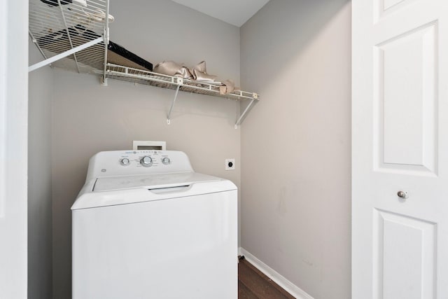 1552 SW Neponset Rd, Port Saint Lucie, FL 34953 - laundry area featuring washer / clothes dryer, dark wood-style floors, and baseboards
