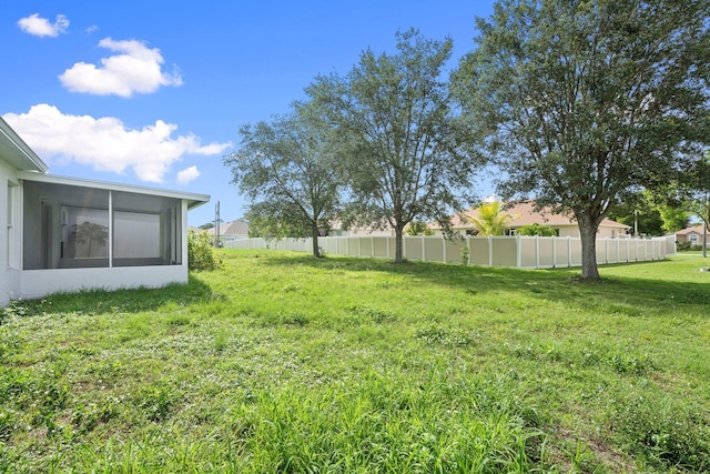 1552 SW Neponset Rd, Port Saint Lucie, FL 34953 - view of yard with a sunroom